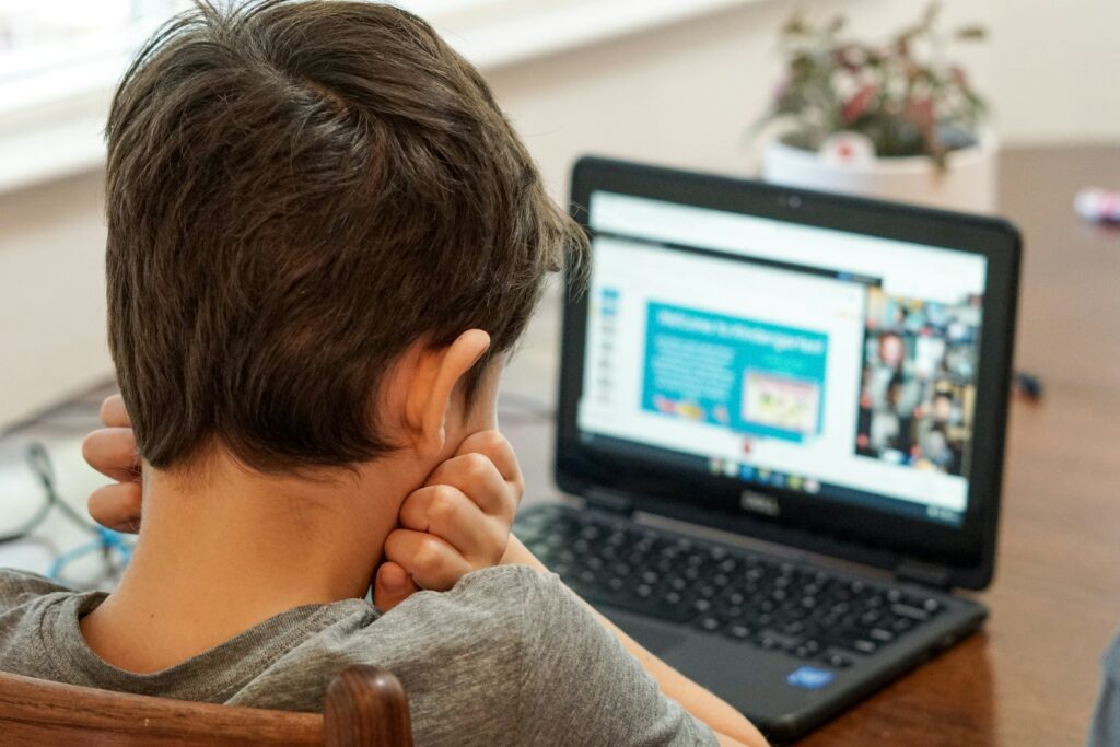 A child using the internet on a laptop.