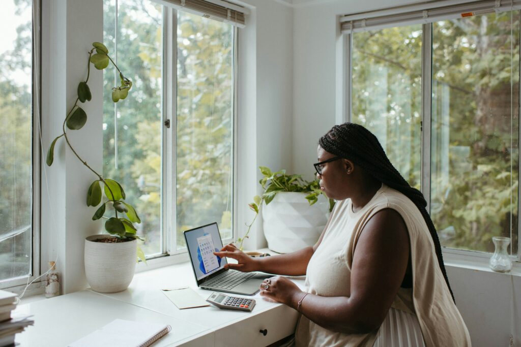 Remote work: A woman using a laptop while working from home.